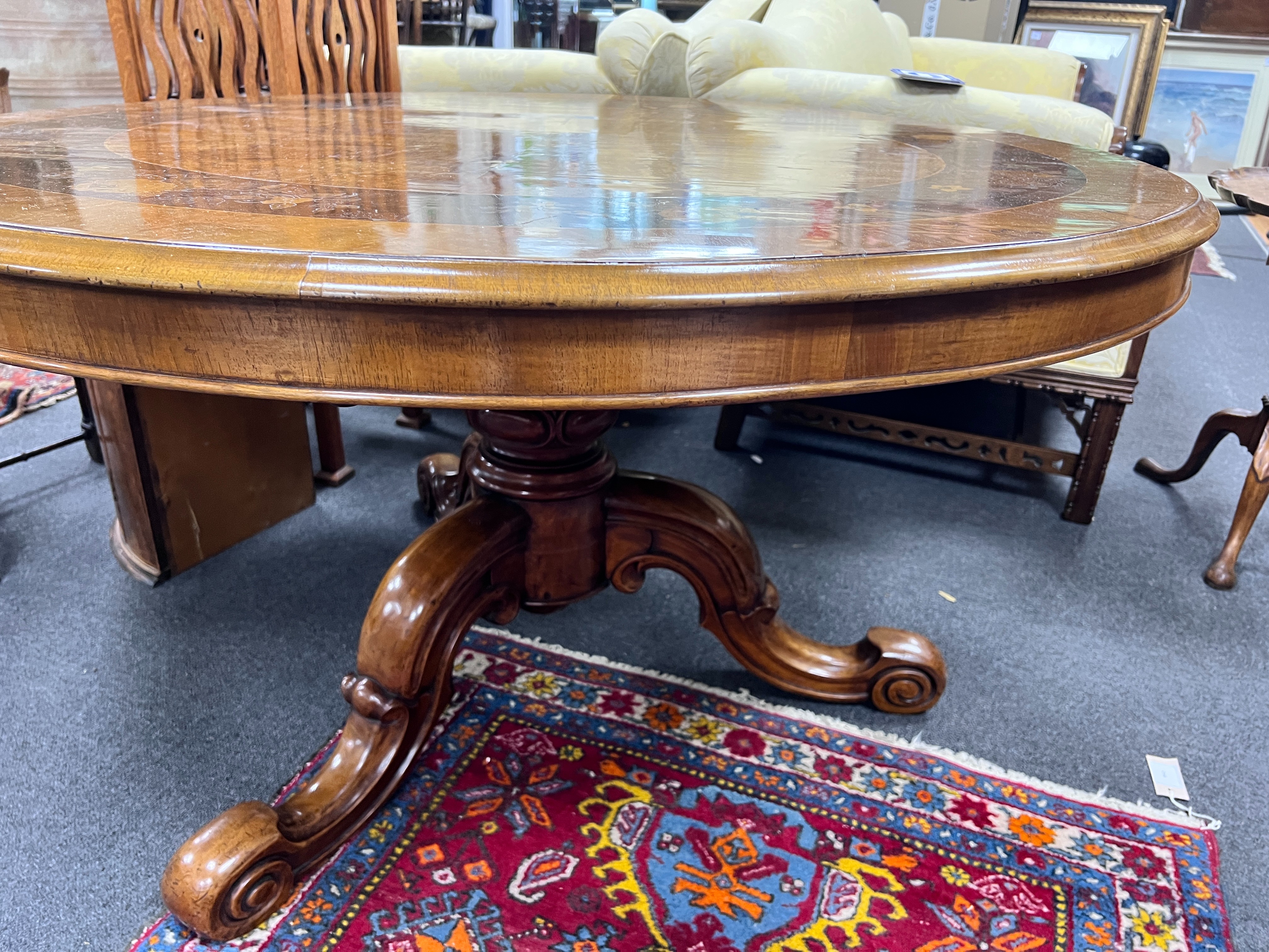 A Victorian floral marquetry inlaid figured walnut circular tilt top breakfast table, diameter 126cm, height 70cm